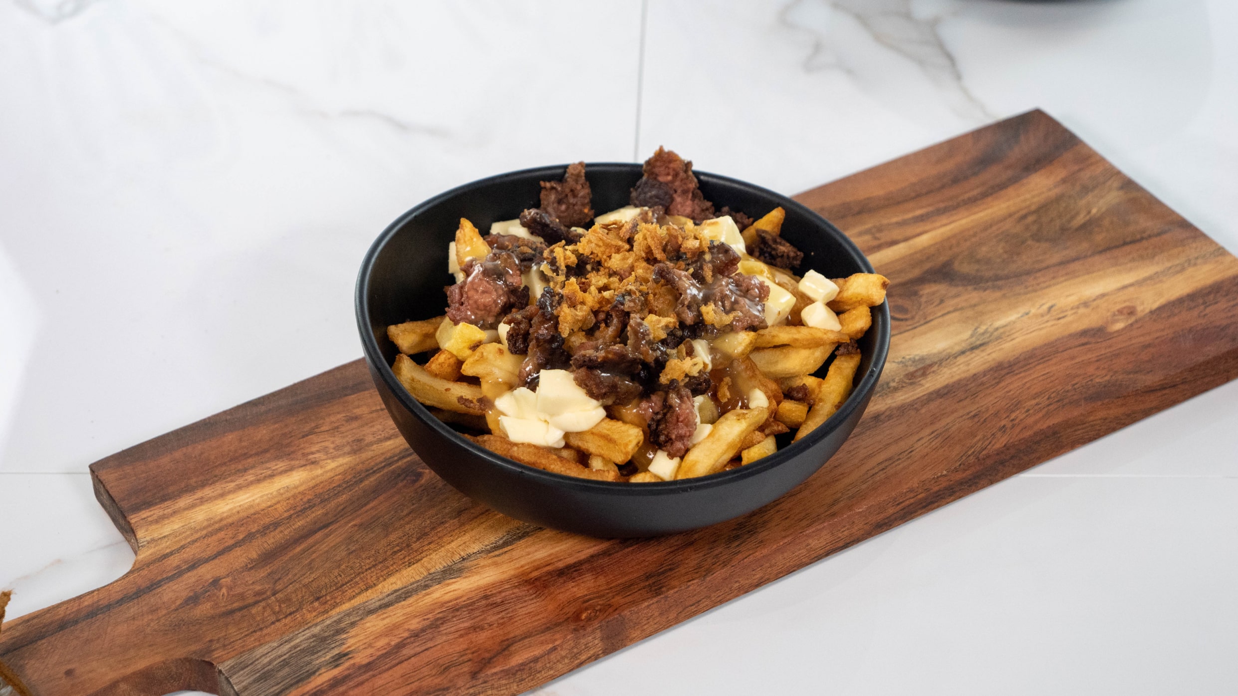 Poutine Mon Caribou pour gagner deux billets pour le Québec